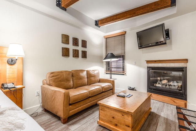 living room with beam ceiling and hardwood / wood-style floors