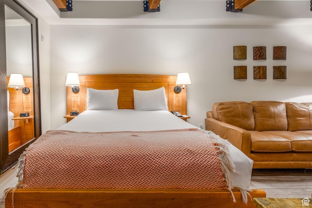 bedroom featuring beam ceiling
