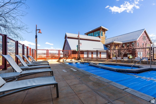 view of swimming pool featuring a patio