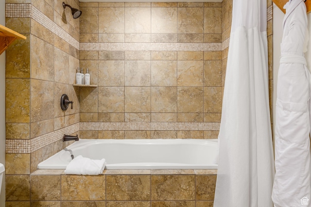 bathroom with shower / bath combination with curtain