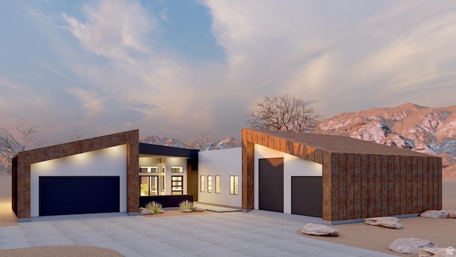 2235 Salida Del Sol, Moab, UT 84532 - contemporary home featuring a garage, driveway, and a mountain view