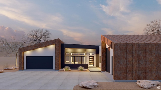 2235 Salida Del Sol, Moab, UT 84532 - modern home featuring an attached garage and concrete driveway