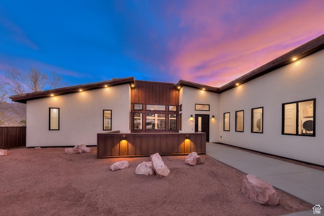 2194 Salida Del Sol, Moab, UT 84532 - view of front of home featuring a patio, stucco siding, and fence