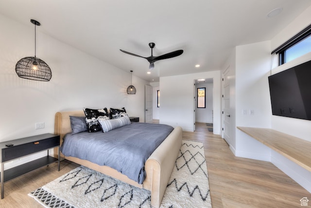 2194 Salida Del Sol, Moab, UT 84532 - bedroom featuring recessed lighting, light wood-style flooring, multiple windows, and baseboards