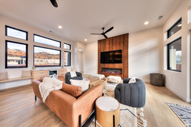 2194 Salida Del Sol, Moab, UT 84532 - living room featuring visible vents, light wood-type flooring, a ceiling fan, and baseboards