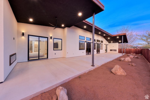 2194 Salida Del Sol, Moab, UT 84532 - back of house featuring a patio area, stucco siding, and fence
