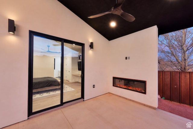 2194 Salida Del Sol, Moab, UT 84532 - view of patio / terrace featuring a glass covered fireplace, fence, and a ceiling fan