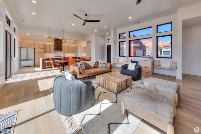 2194 Salida Del Sol, Moab, UT 84532 - living area featuring ceiling fan, recessed lighting, light wood-style floors, and baseboards
