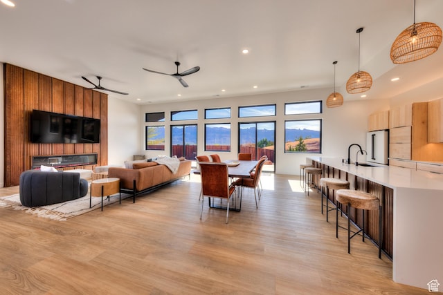 2194 Salida Del Sol, Moab, UT 84532 - living room featuring light wood finished floors, ceiling fan, recessed lighting, and a healthy amount of sunlight