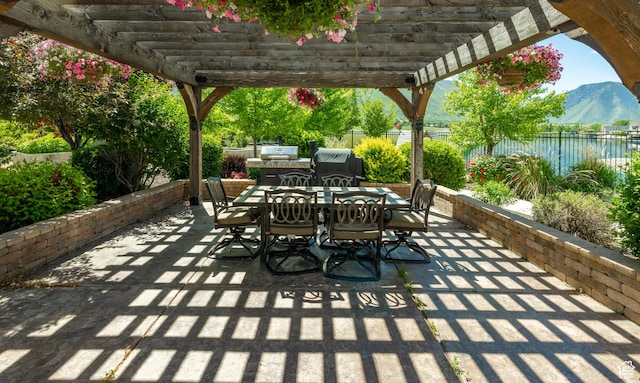 340 E Maple St, Mapleton, UT 84664 - fenced backyard featuring outdoor dining area, a pergola, a patio area, and a grill
