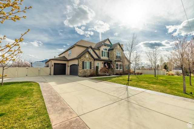 340 E Maple St, Mapleton, UT 84664 - view of front facade featuring a front yard and a garage