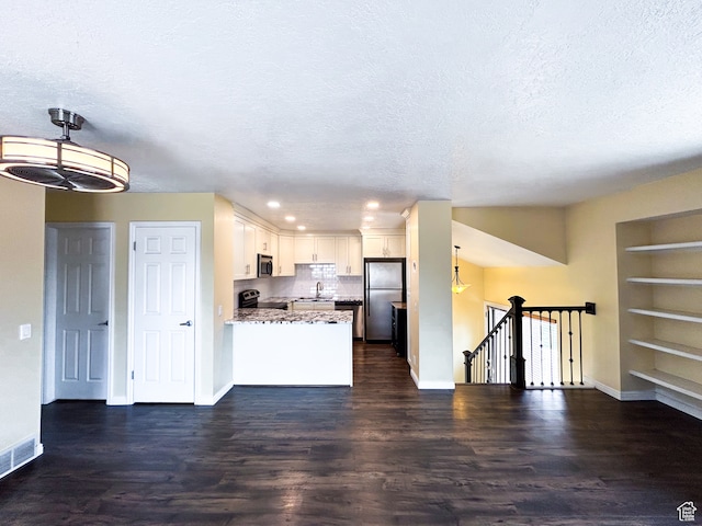 764 W 1275 N, Farmington, UT 84025 - kitchen with appliances with stainless steel finishes, white cabinetry, a textured ceiling, and dark hardwood / wood-style flooring
