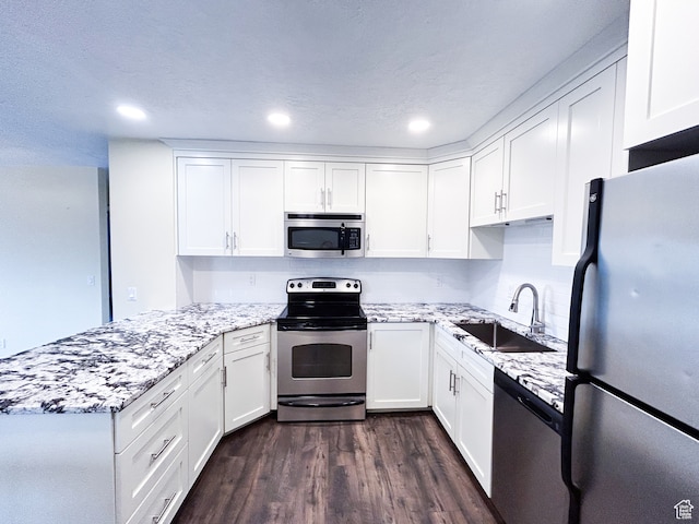 764 W 1275 N, Farmington, UT 84025 - kitchen featuring appliances with stainless steel finishes, light stone counters, dark hardwood / wood-style flooring, sink, and white cabinetry
