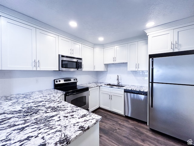 764 W 1275 N, Farmington, UT 84025 - kitchen featuring light stone countertops, dark hardwood / wood-style floors, sink, stainless steel appliances, and white cabinets