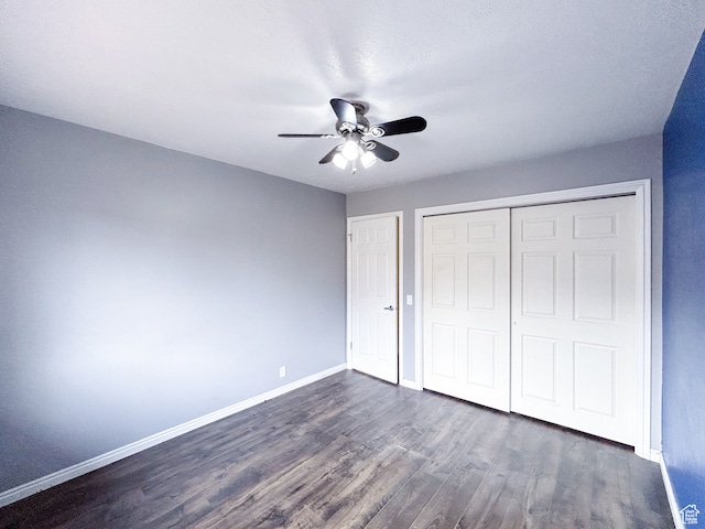 764 W 1275 N, Farmington, UT 84025 - unfurnished bedroom with a closet, ceiling fan, and dark hardwood / wood-style floors