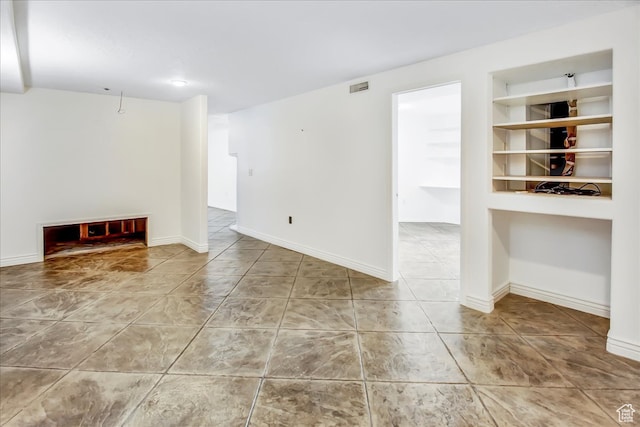 1075 W 4175 S, Riverdale, UT 84405 - unfurnished living room featuring built in features and tile floors