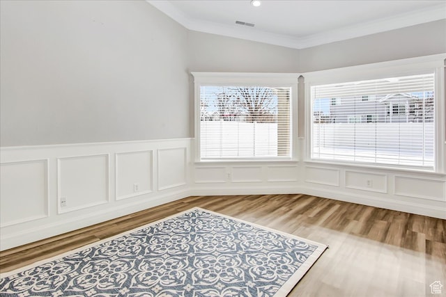 1075 W 4175 S, Riverdale, UT 84405 - unfurnished room with crown molding and light hardwood / wood-style flooring