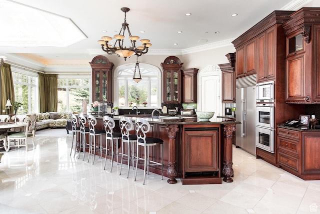 533 N Left Fork Hobble Creek Cyn, Springville, UT 84663 - kitchen with light tile flooring, hanging light fixtures, an island with sink, a notable chandelier, and stainless steel appliances