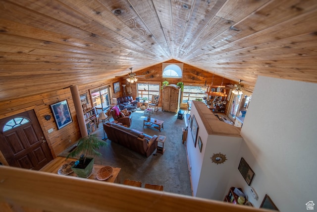 unfurnished living room featuring wooden walls, vaulted ceiling, carpet, and wooden ceiling