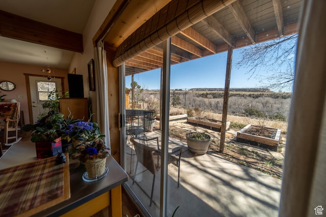 sunroom with beam ceiling