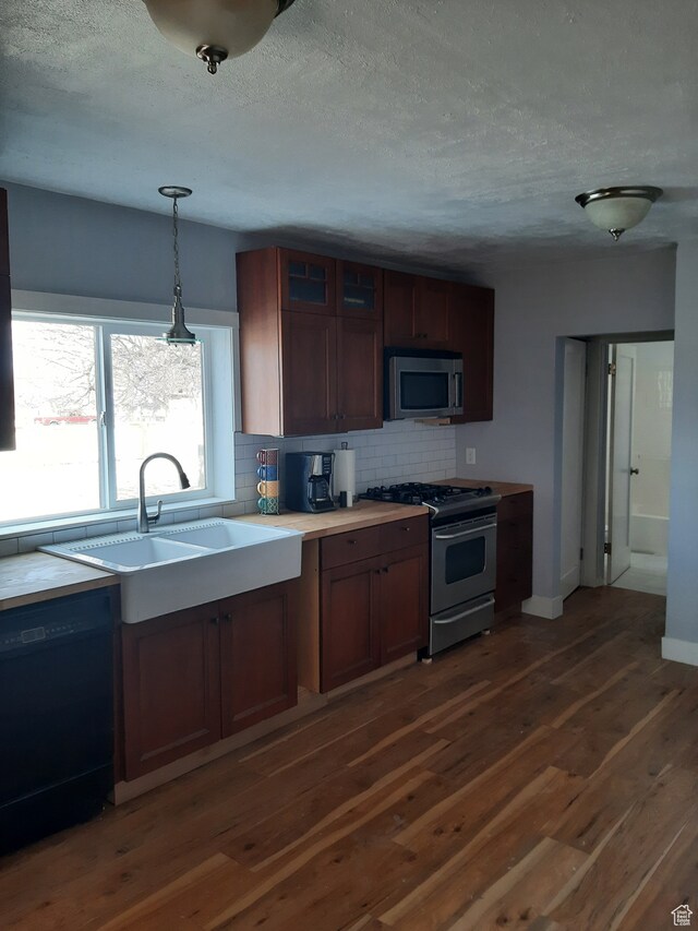 497 N 200 E, Mayfield, UT 84643 - kitchen featuring tasteful backsplash, dark hardwood / wood-style floors, stainless steel appliances, sink, and hanging light fixtures