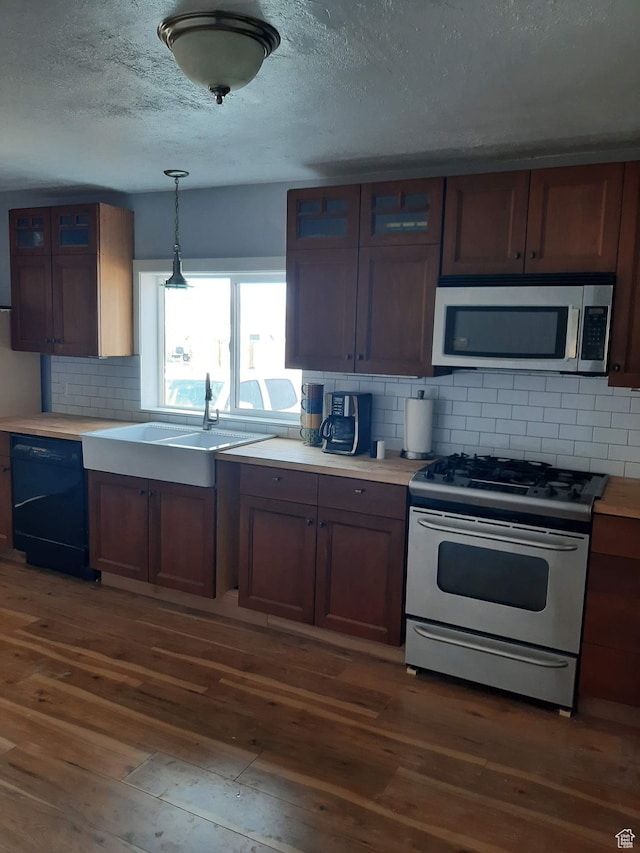 497 N 200 E, Mayfield, UT 84643 - kitchen with range with gas cooktop, tasteful backsplash, dark hardwood / wood-style floors, and dishwasher