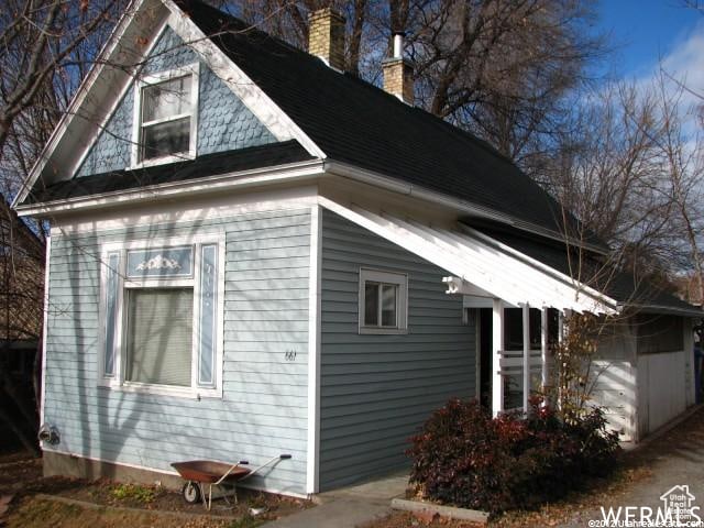 view of side of property with a garage