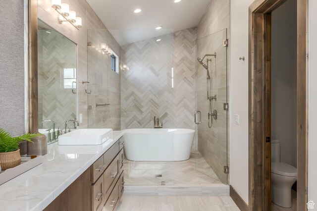 1905 E Kings Peak Cir, Heber City, UT 84032 - bathroom featuring recessed lighting, toilet, vanity, a shower stall, and a freestanding tub