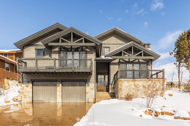 1905 E Kings Peak Cir, Heber City, UT 84032 - view of front of property with stone siding, concrete driveway, a balcony, and an attached garage
