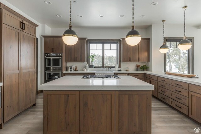 1905 E Kings Peak Cir, Heber City, UT 84032 - kitchen featuring hanging light fixtures, appliances with stainless steel finishes, and a kitchen island