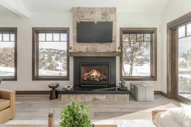 1905 E Kings Peak Cir, Heber City, UT 84032 - interior space featuring baseboards, a fireplace, and light wood finished floors