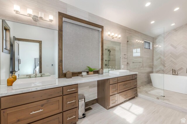 1905 E Kings Peak Cir, Heber City, UT 84032 - bathroom featuring a shower with shower door, a freestanding tub, recessed lighting, and vanity