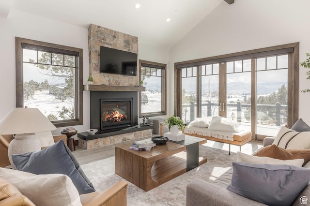 1905 E Kings Peak Cir, Heber City, UT 84032 - living area featuring light wood-type flooring, a fireplace, high vaulted ceiling, and recessed lighting