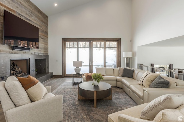 1905 E Kings Peak Cir, Heber City, UT 84032 - living room with dark wood finished floors, french doors, a fireplace, high vaulted ceiling, and recessed lighting