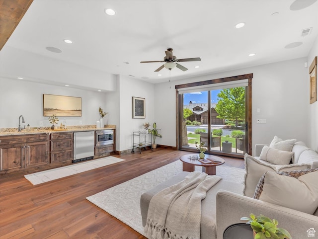1707 E Kings Peak Cir N, Heber City, UT 84032 - living room with bar with sink, light wood finished floors, recessed lighting, and ceiling fan