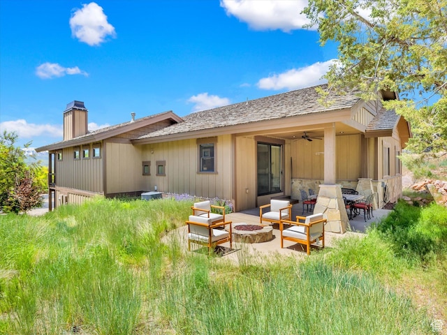 1707 E Kings Peak Cir N, Heber City, UT 84032 - back of house with a chimney, a patio, ceiling fan, an outdoor living space with a fire pit, and a shingled roof