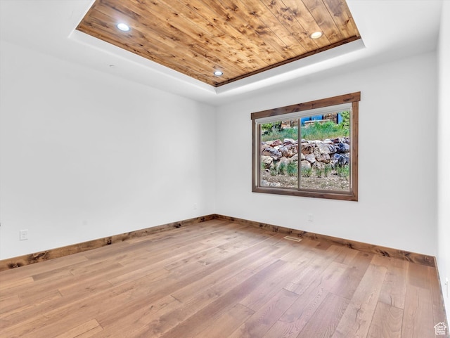 1707 E Kings Peak Cir N, Heber City, UT 84032 - empty room featuring a tray ceiling, wooden ceiling, hardwood / wood-style floors, and recessed lighting