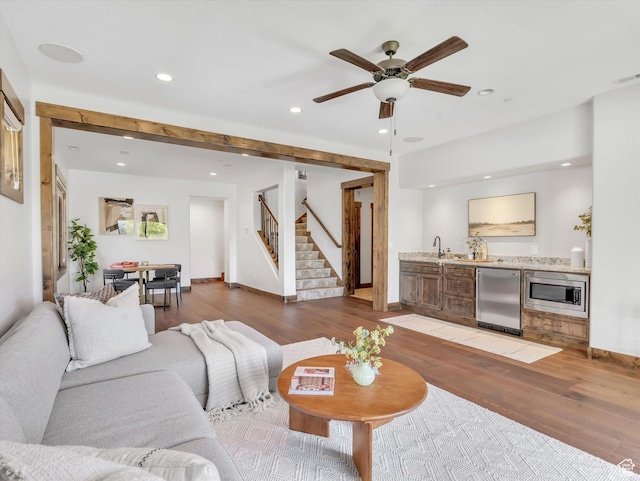 1707 E Kings Peak Cir N, Heber City, UT 84032 - living room with light wood-type flooring, wet bar, recessed lighting, stairway, and a ceiling fan