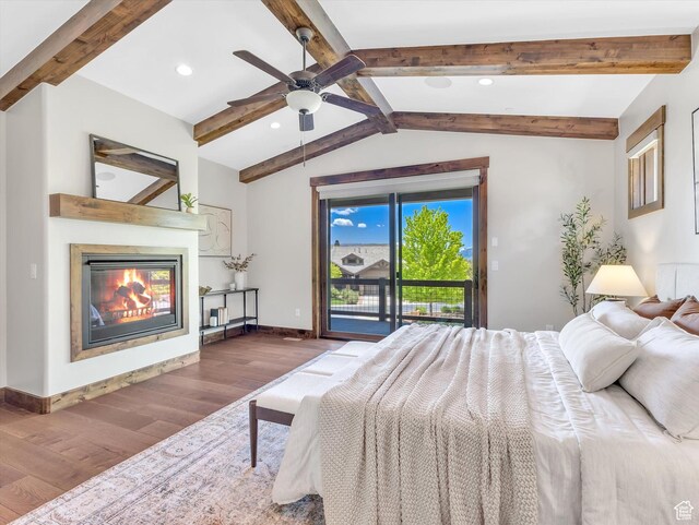 1707 E Kings Peak Cir N, Heber City, UT 84032 - bedroom with wood finished floors, access to outside, a glass covered fireplace, recessed lighting, and a ceiling fan