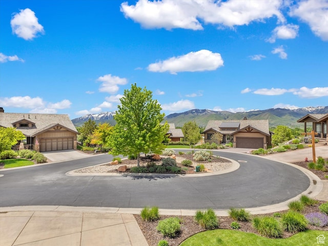 1707 E Kings Peak Cir N, Heber City, UT 84032 - view of front of property featuring a mountain view, a garage, and stone siding