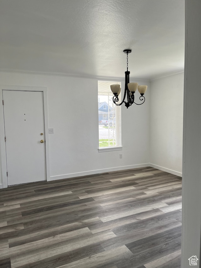 55 E 200 S, Ephraim, UT 84627 - empty room with dark hardwood / wood-style flooring, a notable chandelier, and a textured ceiling
