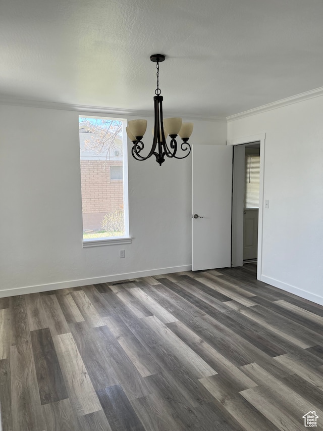 55 E 200 S, Ephraim, UT 84627 - empty room with ornamental molding, a notable chandelier, and dark hardwood / wood-style floors