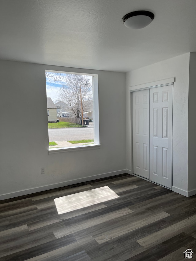 55 E 200 S, Ephraim, UT 84627 - unfurnished bedroom with dark wood-type flooring and a closet