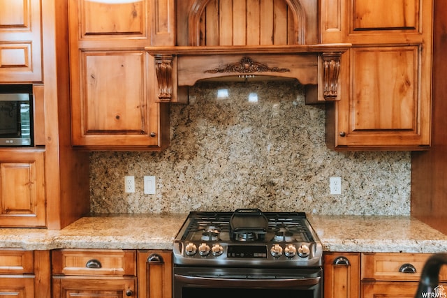 493 N 12500 W, Bluebell, UT 84007 - kitchen with range with gas cooktop, tasteful backsplash, and light stone countertops