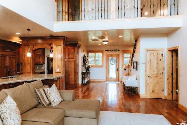 493 N 12500 W, Bluebell, UT 84007 - living room with dark hardwood / wood-style flooring, a towering ceiling, and sink