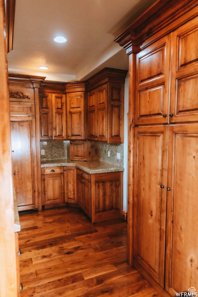 493 N 12500 W, Bluebell, UT 84007 - kitchen featuring backsplash, dark hardwood / wood-style floors, and light stone counters