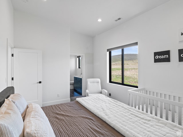 2971 S Sand Trap Cir Unit 64, Garden City, UT 84028 - bedroom featuring ensuite bathroom and a nursery area