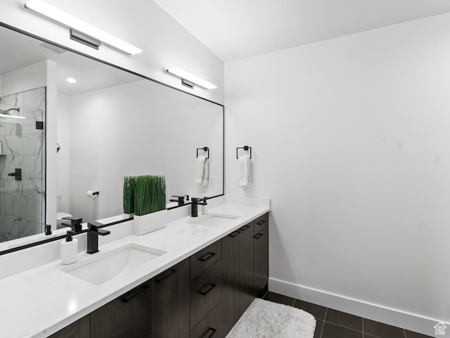 2971 S Sand Trap Cir Unit 64, Garden City, UT 84028 - bathroom featuring walk in shower, oversized vanity, tile floors, and dual sinks