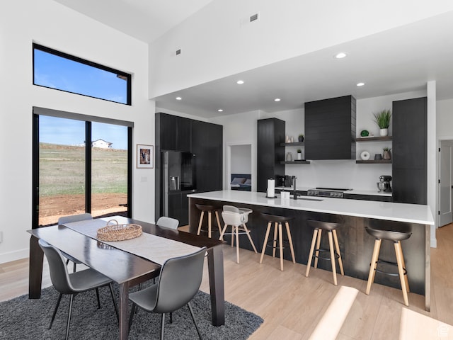 2971 S Sand Trap Cir Unit 64, Garden City, UT 84028 - dining area featuring sink and light wood-type flooring