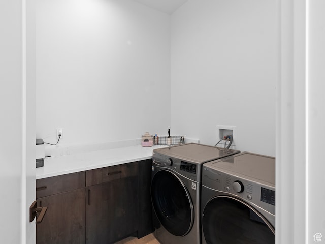 2971 S Sand Trap Cir Unit 64, Garden City, UT 84028 - clothes washing area with washer and clothes dryer, cabinets, and hookup for a washing machine